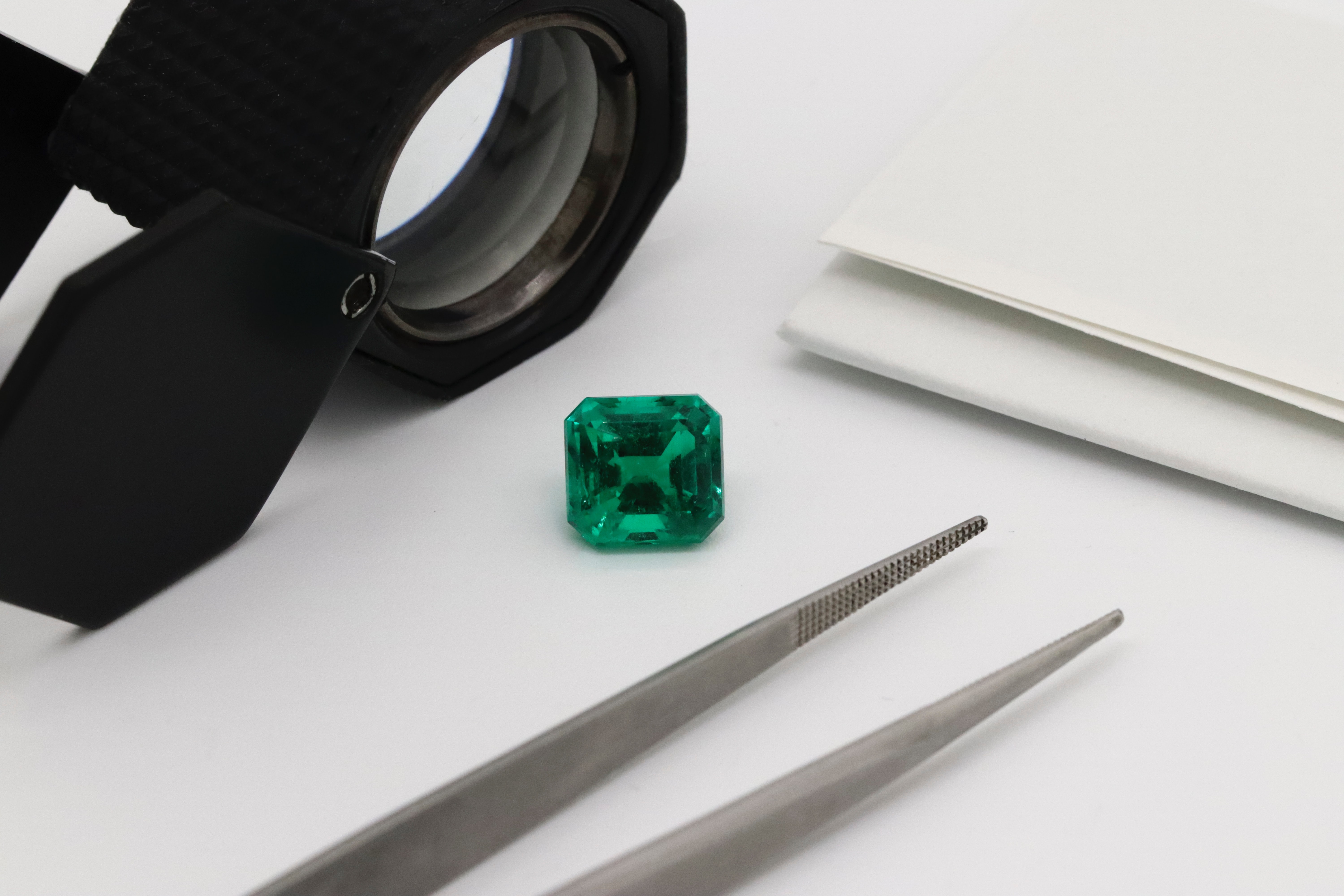 Emerald with jeweler tools